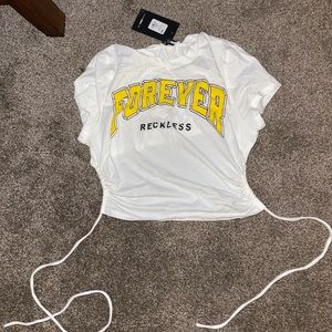 NWT: Never worn. Fashion Nova shirt with open back